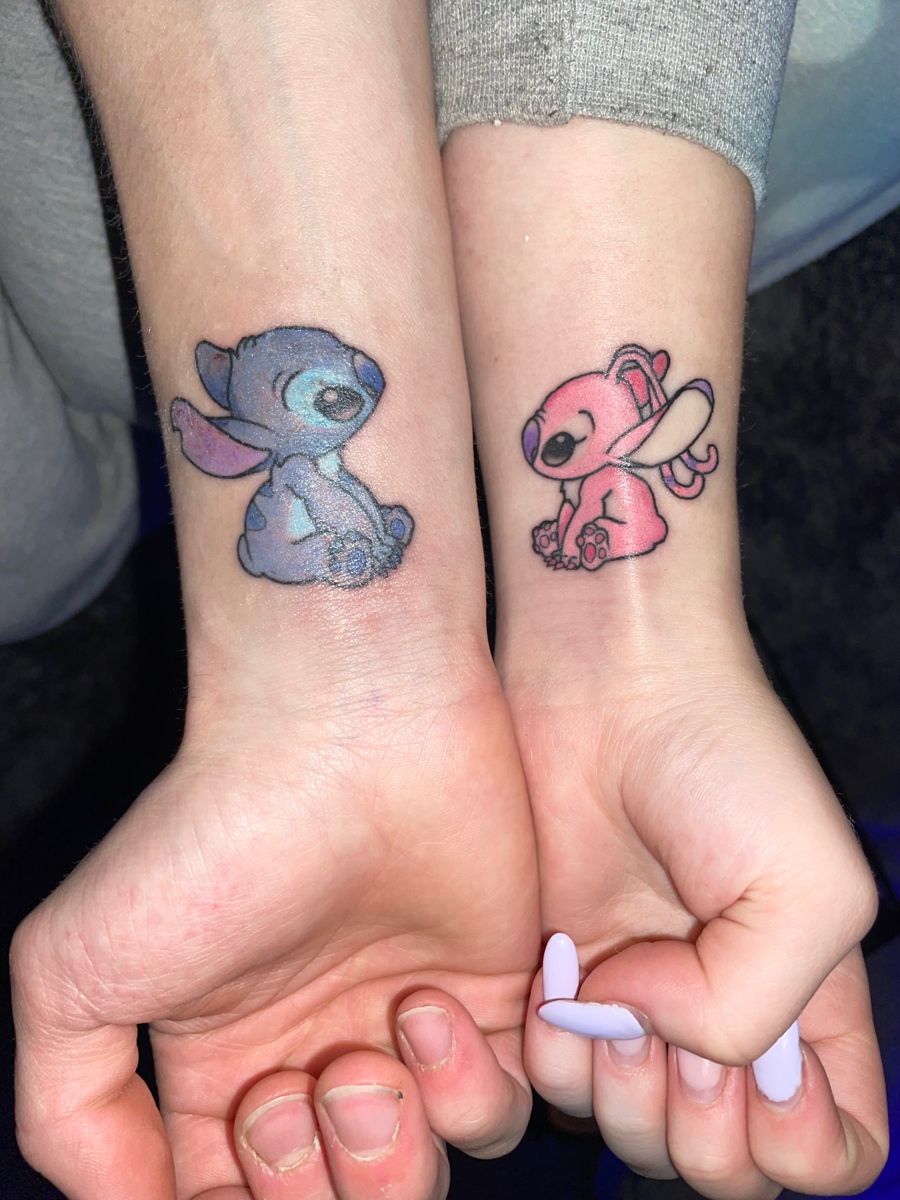 Blue and pink stitch couple tattoo