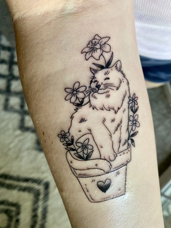 Cat and plants tattoo