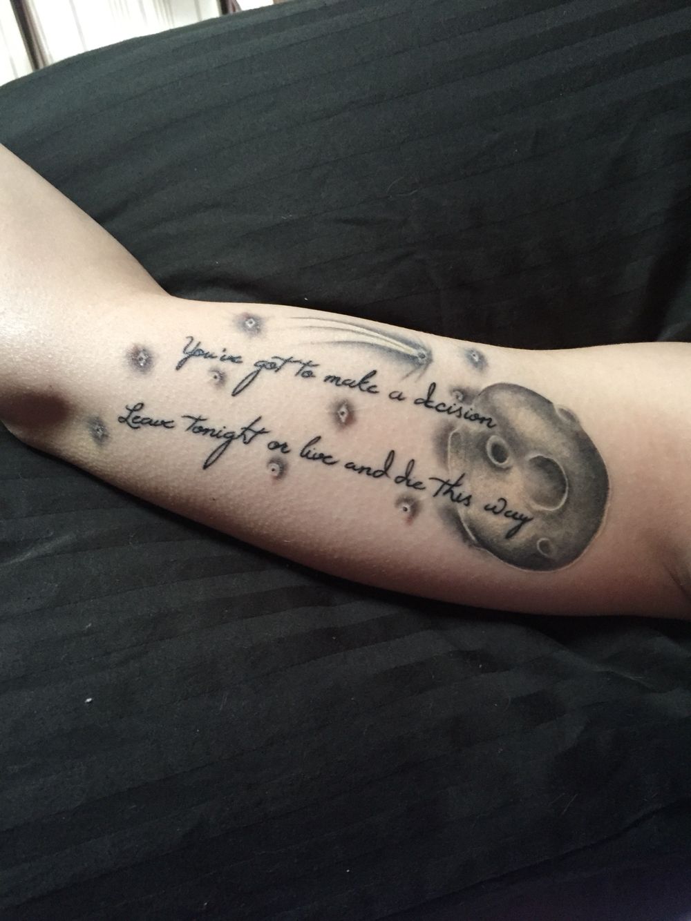 Detailed Tattoo on the Upper Arm