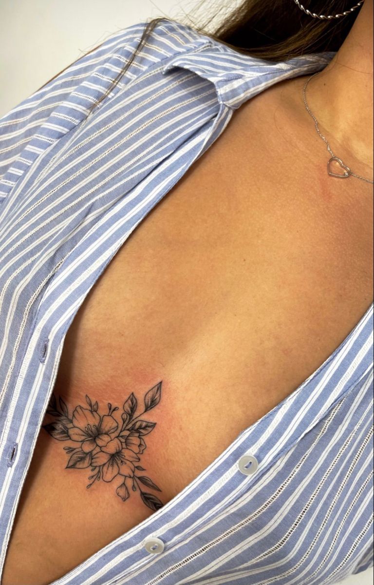 Half breast tattoo