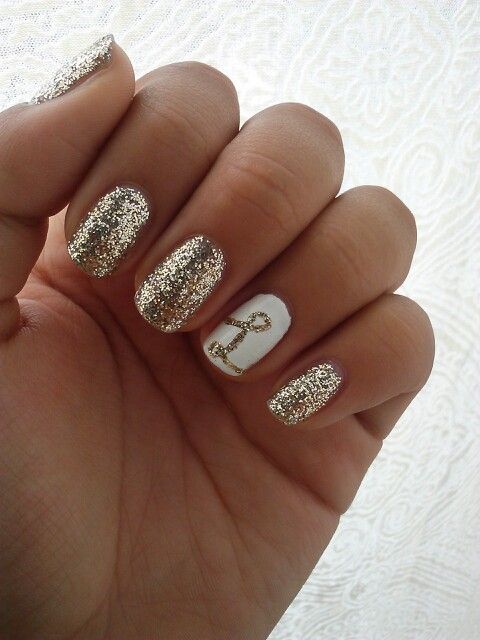 Letter accent nail with gold glitter nails