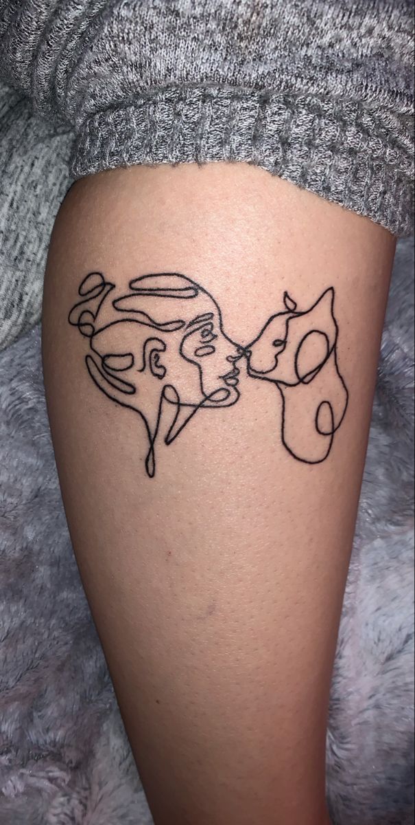 Line drawing tattoo of a girls and cats faces.