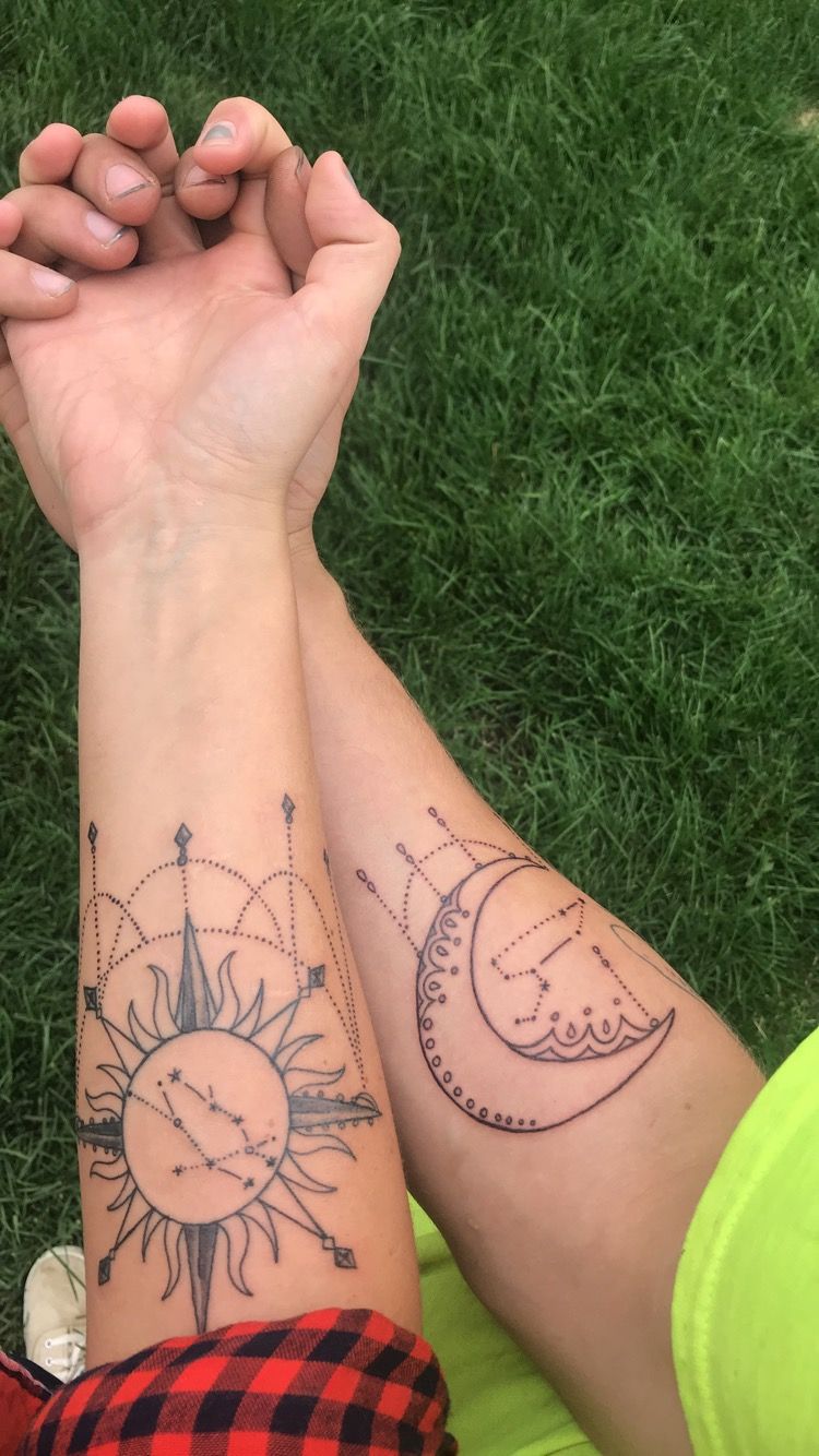 Sun and moon tattoos with zodiac constellation in the center