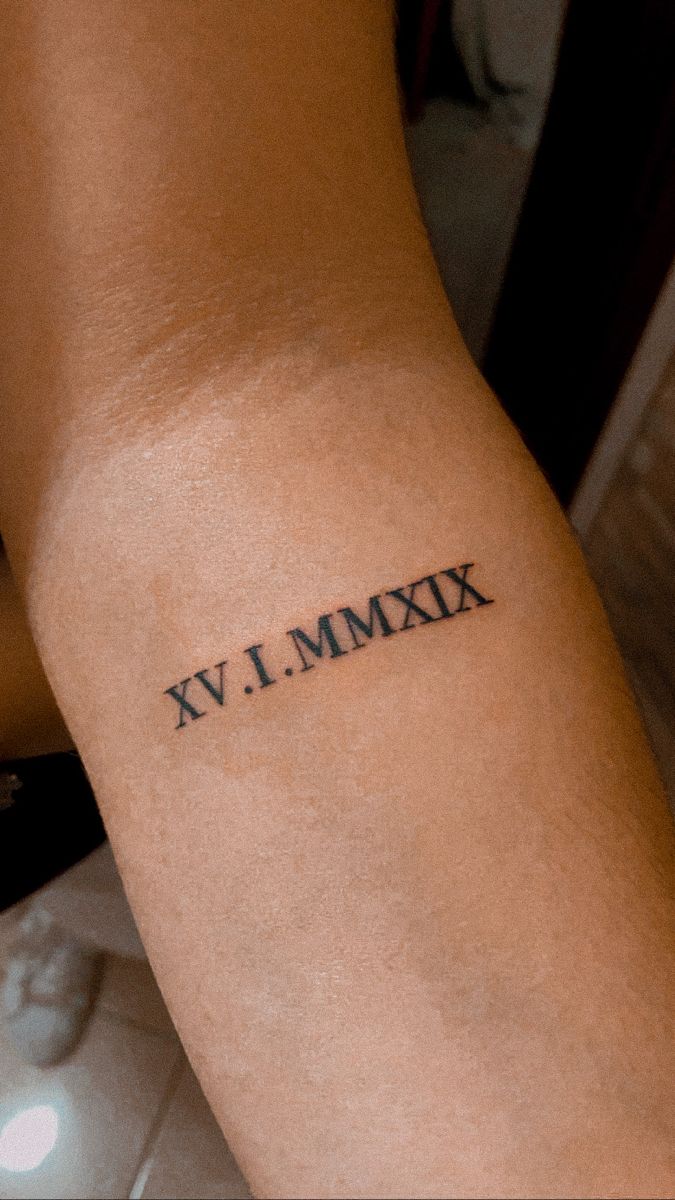 Tattoos with Roman Numerals on the Back of the Arm