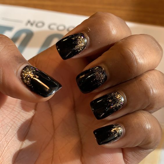 The black and sparkly nails