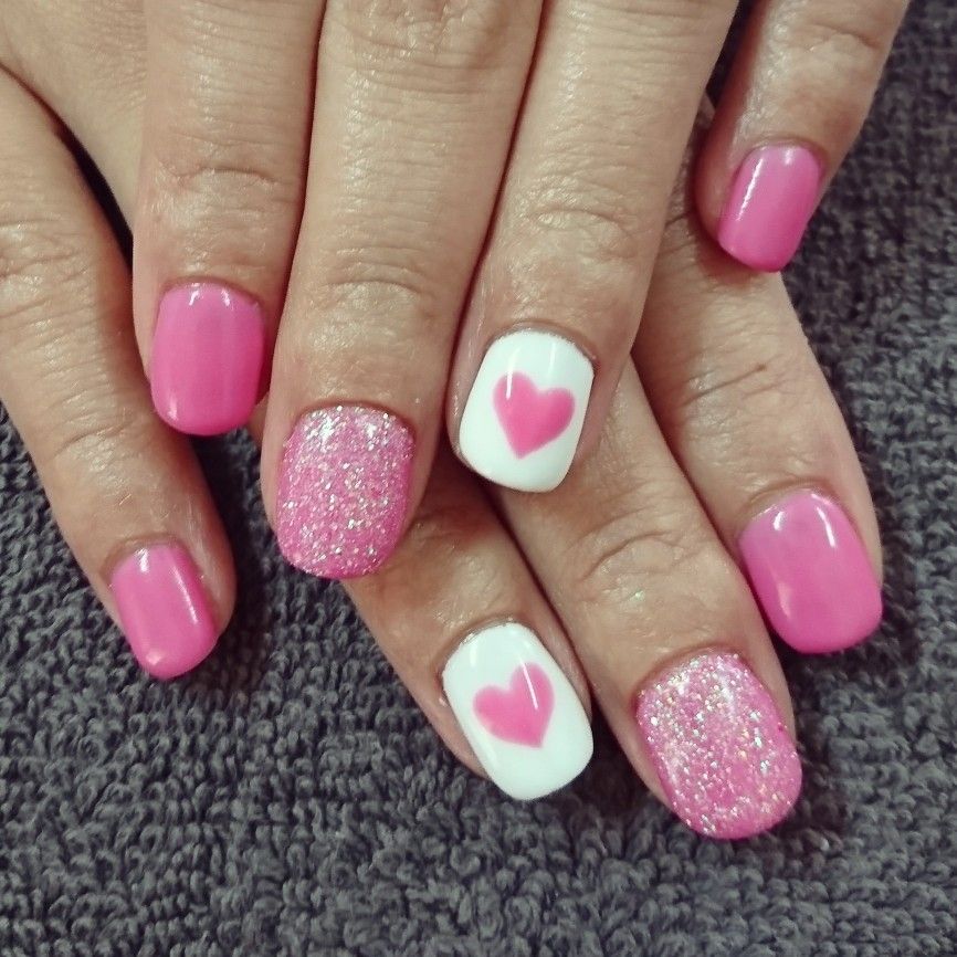 Pink and white nails with big pink heart and pink glitter