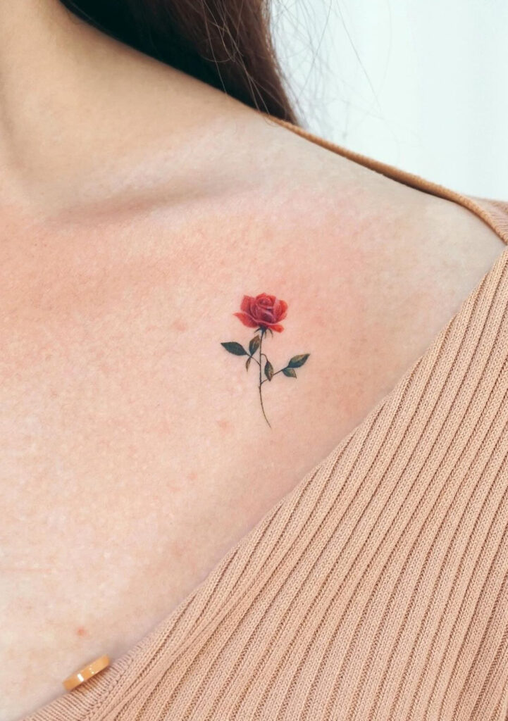 Detailed tiny rose collarbone tattoo