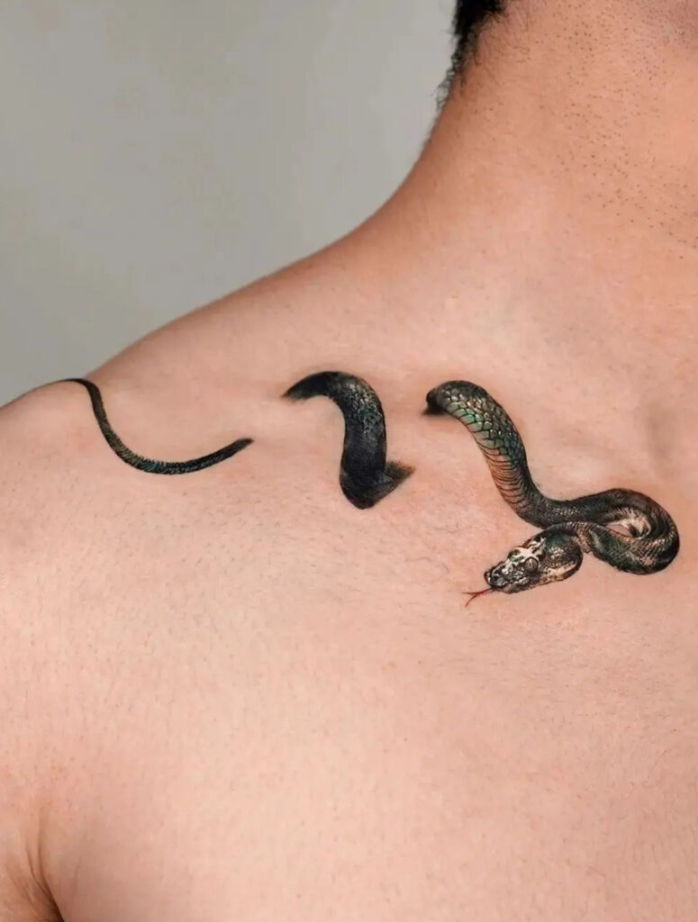 Realistic snake wraparound collarbone tattoo