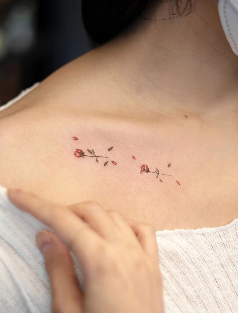 Roses & scattered petals collarbone tattoo