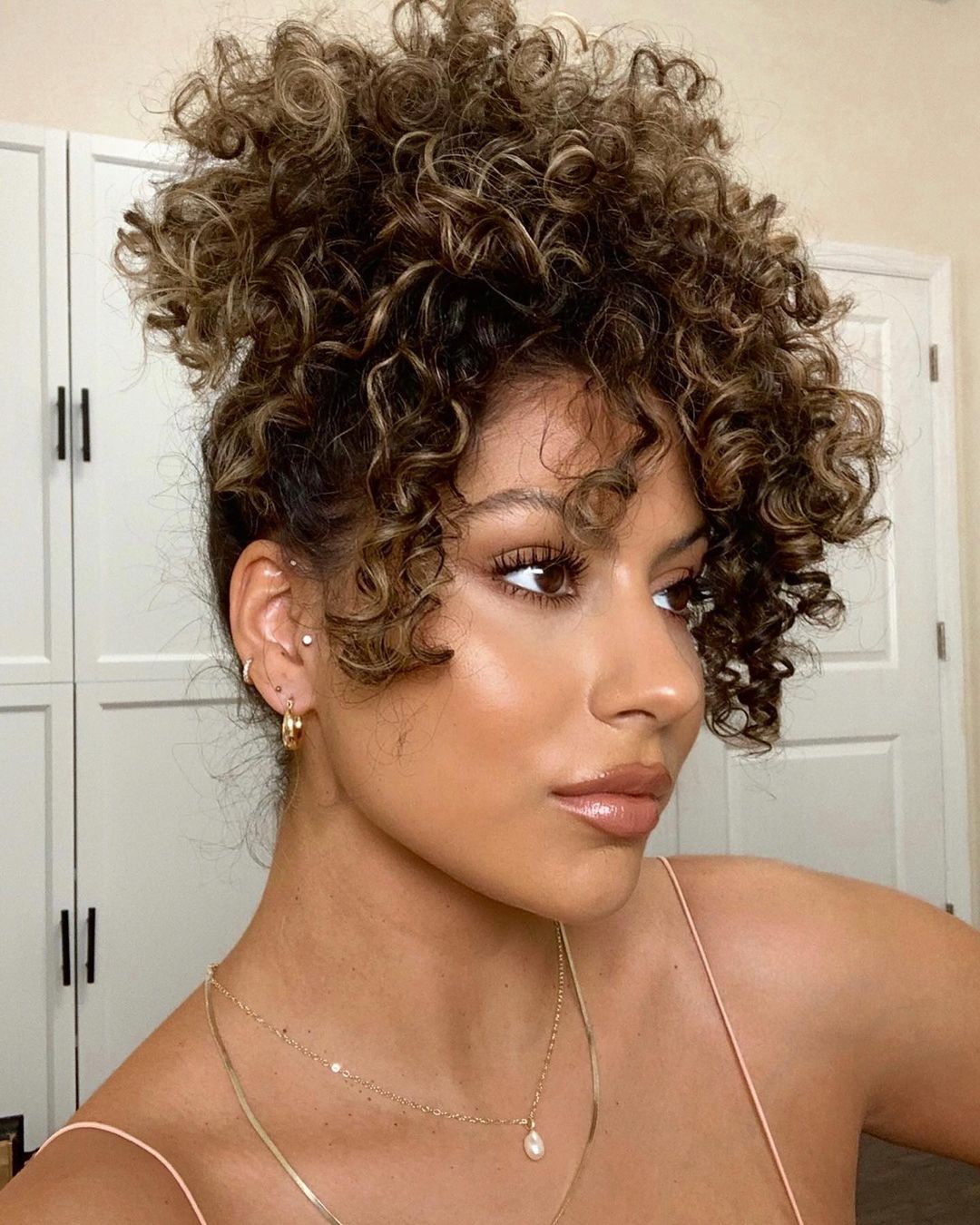 Short curly hairstyles with a lot of volumes