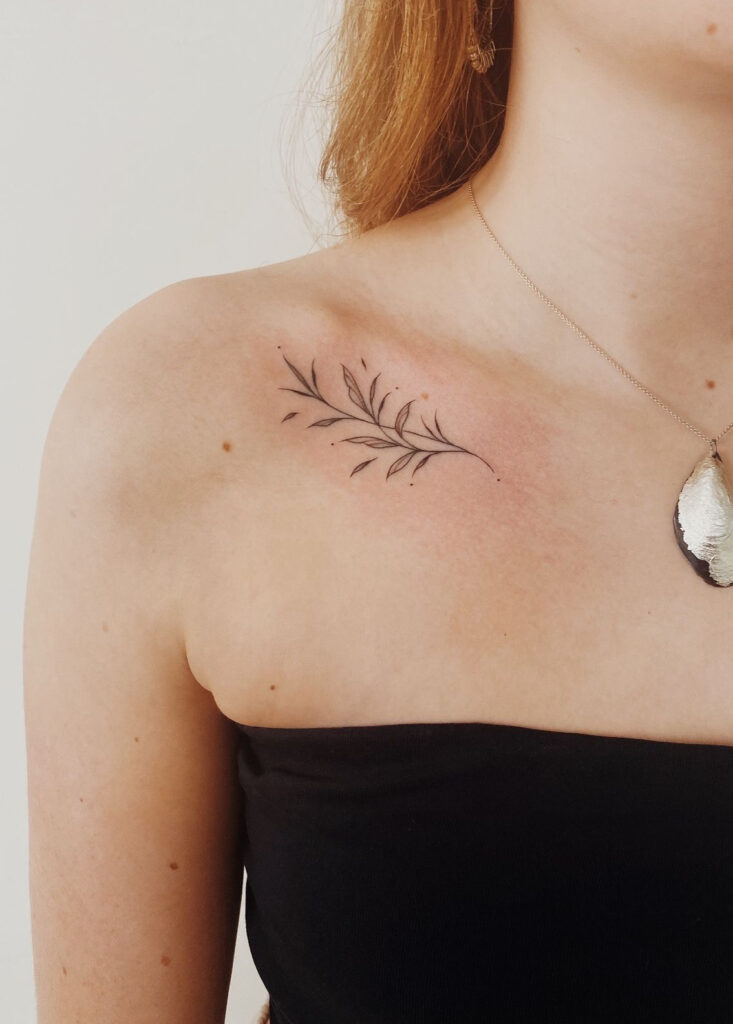 Simple leaves collarbone tattoo