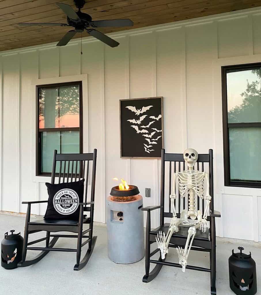 Skeleton On Chair And Black Jack-O-Lanterns