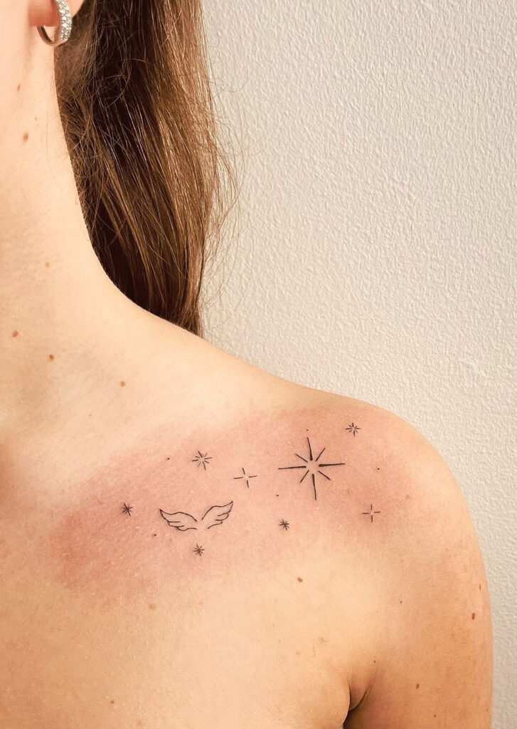 Angel wings & sparkles delicate collarbone tattoo