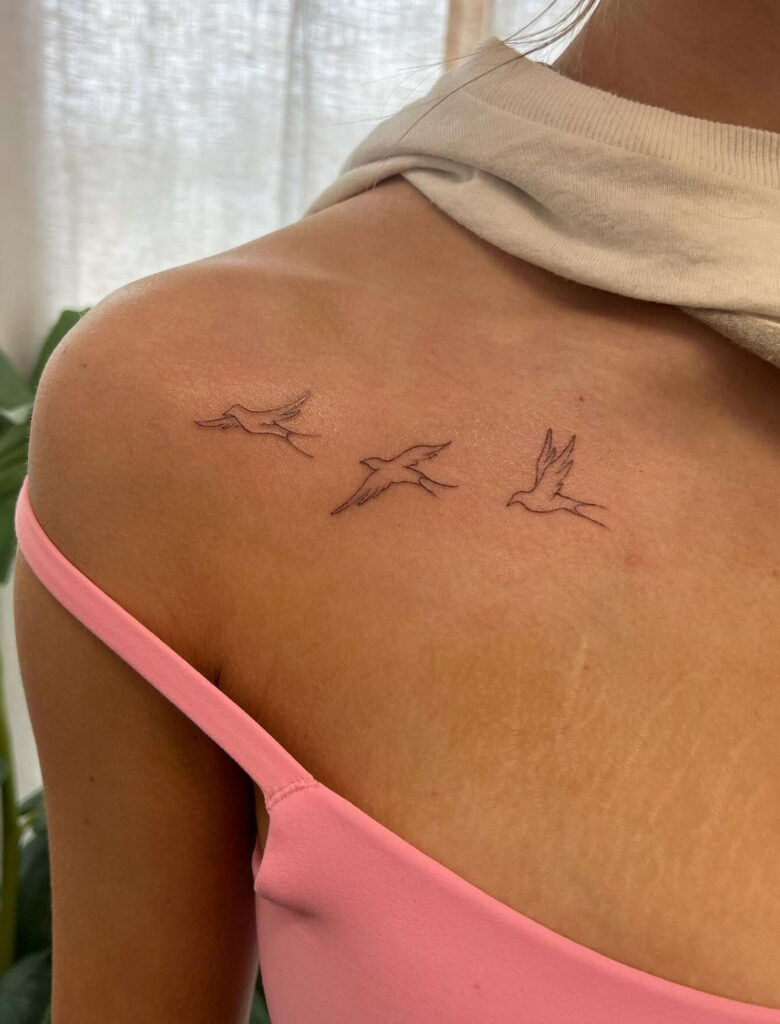 Birds flying small collarbone tattoo