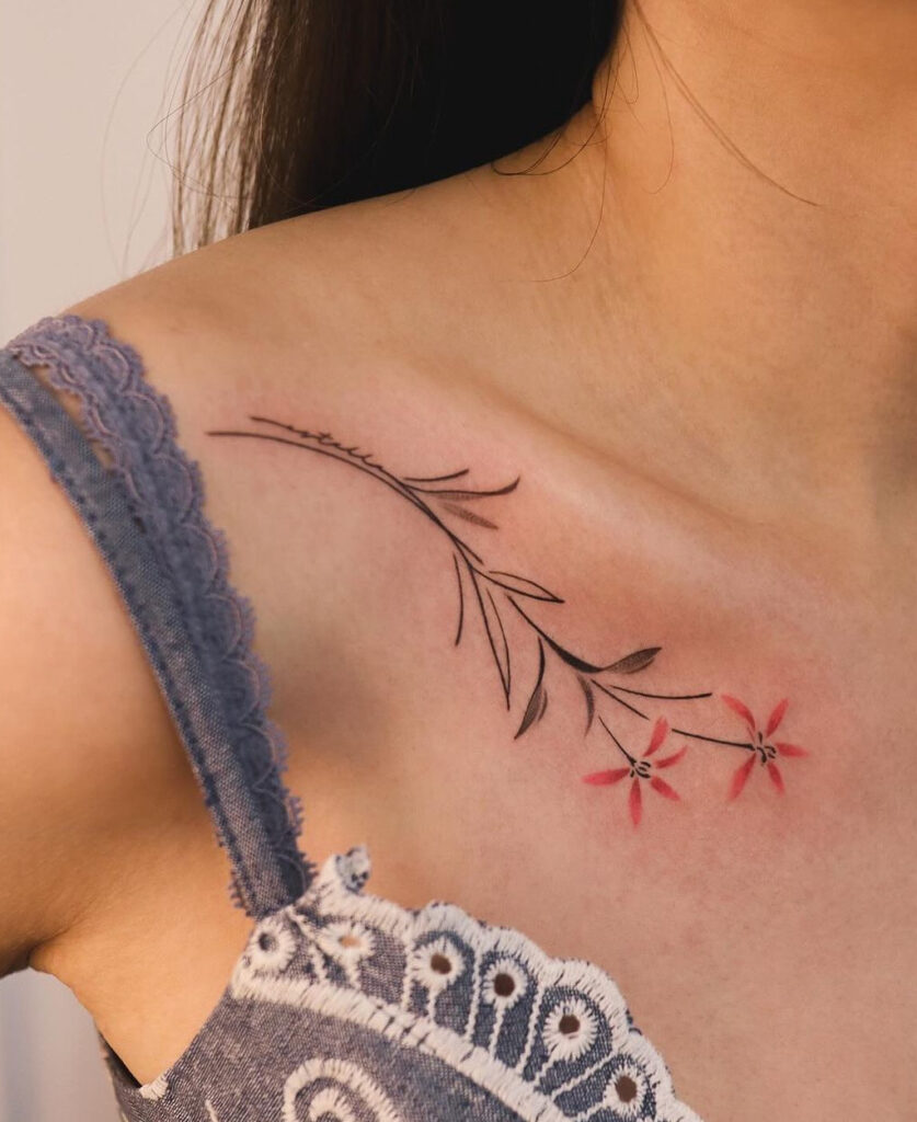 Black & red flowers collarbone tattoo