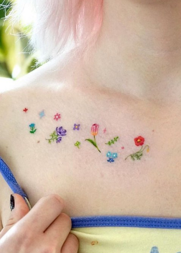 Cute dainty flowers collarbone tattoo