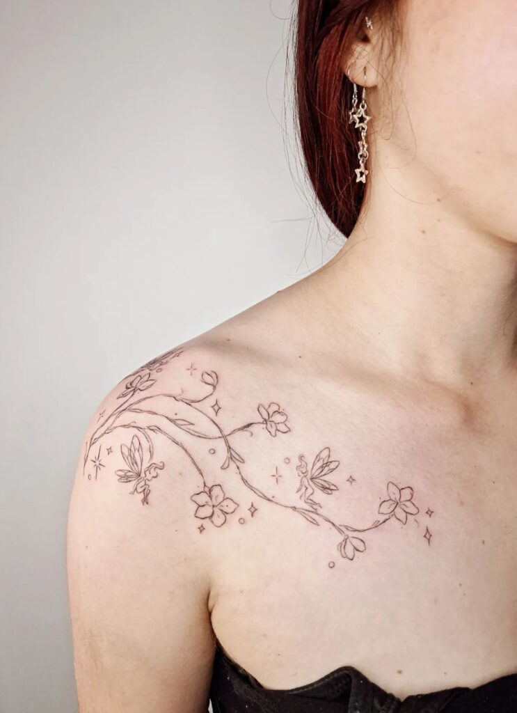 Shoulder to collarbone fineline cherry blossom tattoo