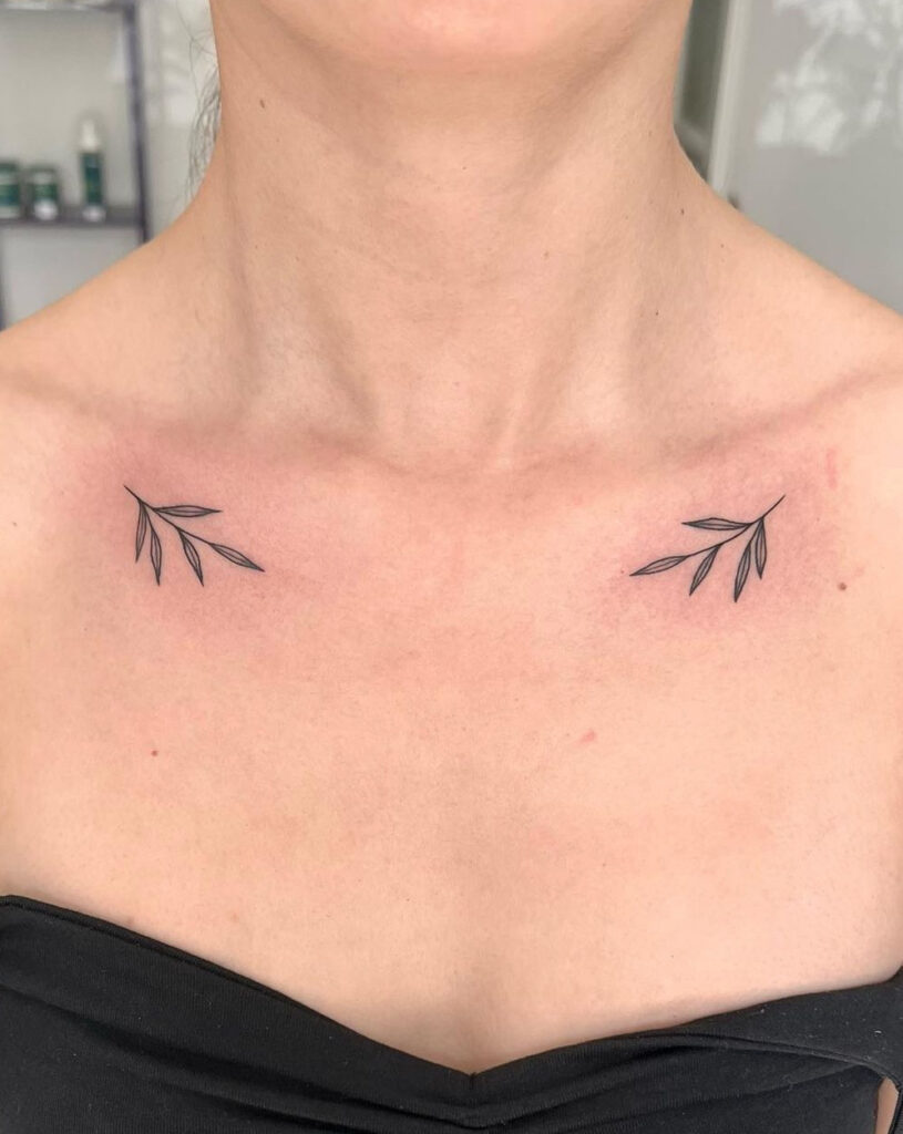 Small simple leaves matchy collarbone tattoos