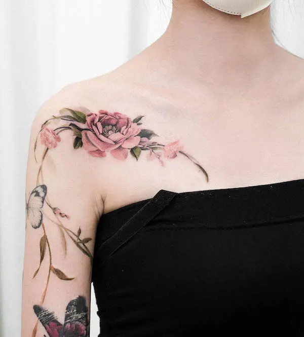 Stunning flower arm and collarbone tattoo