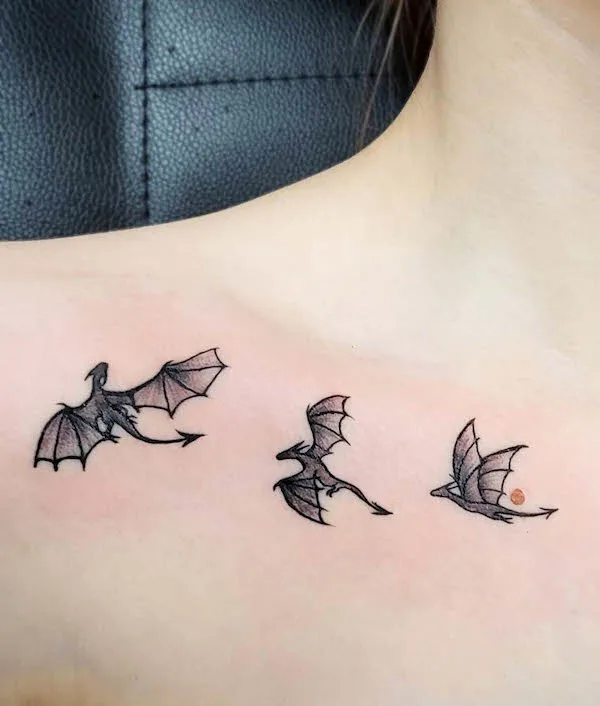 Tiny dragon collarbone tattoo