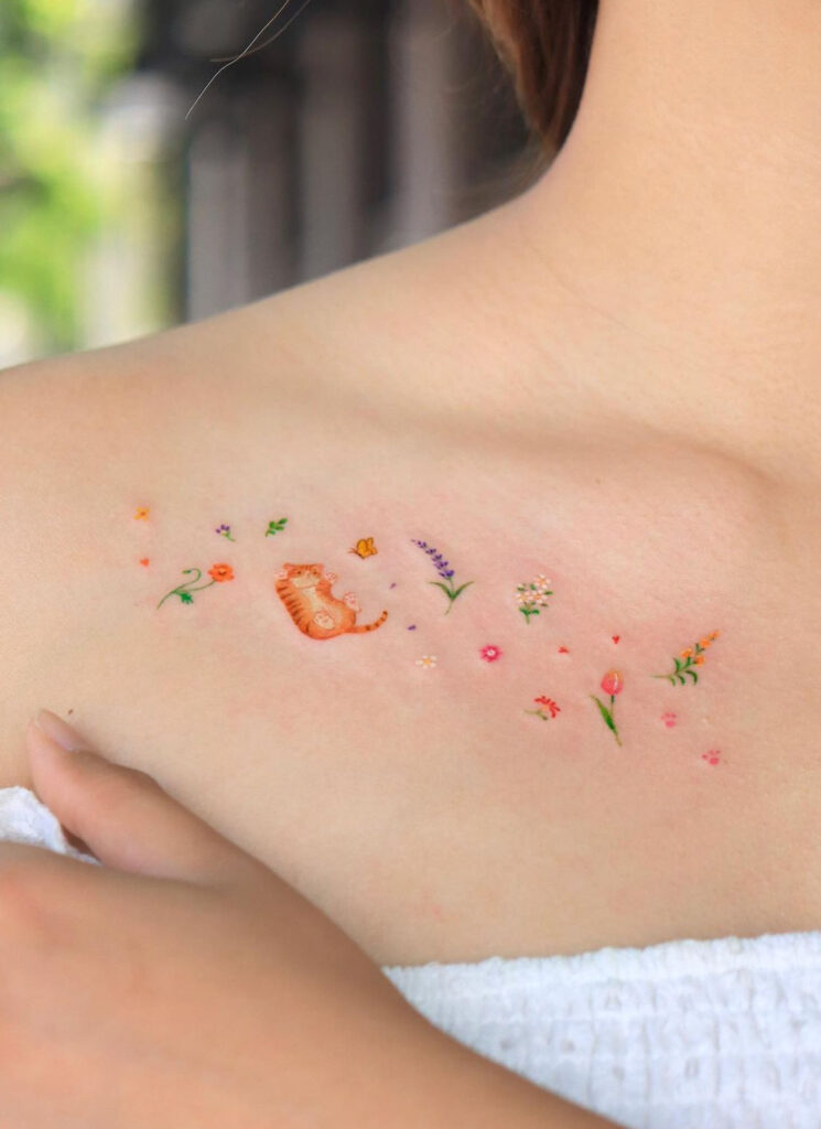 colored collarbone doodle tattoo